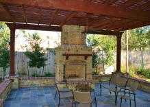 fire-place-pergola-large-bench-and-small-flower-beds