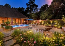 geometric pool with deck jets, tanning ledge and pool landscaping