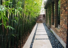 Walkway-with-mexican-beach-pebbles-and-bamboo